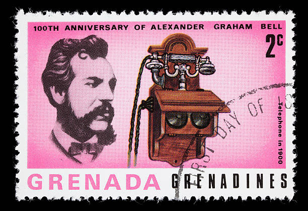 Bell and 1900 telephone postage stamp 1977 Grenada postage stamp with images of Alexander Graham Bell and a 1900 telephone. DSLR with macro lens; no sharpening. alexander graham bell stock pictures, royalty-free photos & images