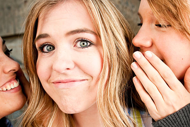 istock Teenage Girls Telling Secrets 176127391