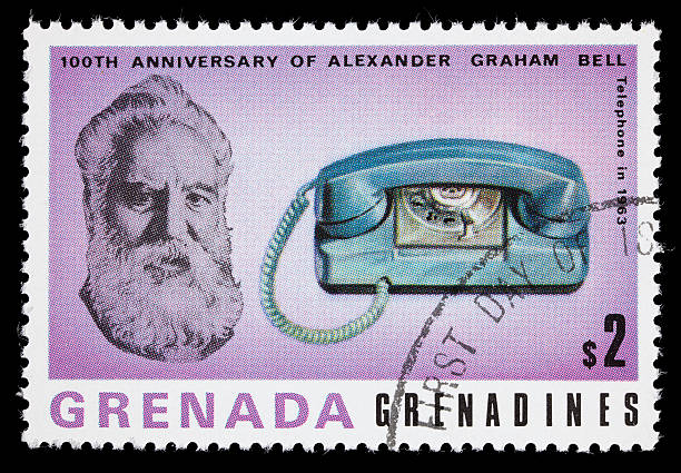 Bell and 1963 telephone postage stamp 1977 Grenada postage stamp with images of Alexander Graham Bell and a 1963 telephone. DSLR with macro lens; no sharpening. alexander graham bell stock pictures, royalty-free photos & images