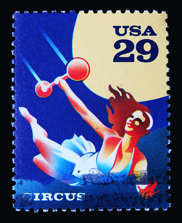 Trapeze artist circus stamp on a black background.