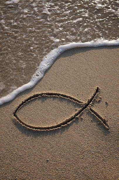 istock Jesus Fish Christian Symbol Outline in Sand 176129501