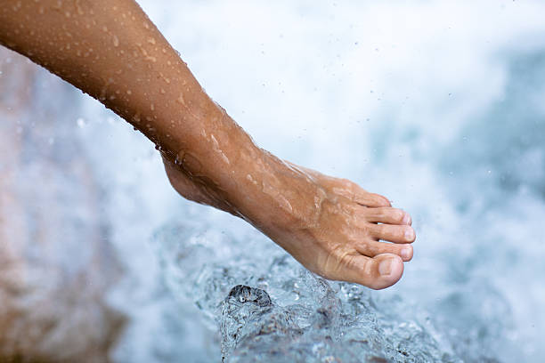 istock wet foot at small waterfall 176130684