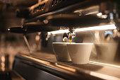 Preparation Of Two Cups Of Coffee On An Espresso Machine At Cafeteria