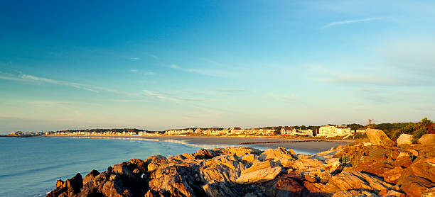 Vacationers' Atlantic Coastal Homes Panorama Panoramic scene of beach Atlantic coast (Rye NH) homes alpenglow lit by the dawn sun. mike cherim stock pictures, royalty-free photos & images