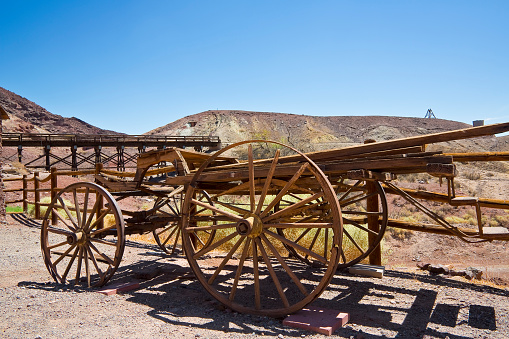 Old abandoned traditional wooden carriage in Calico - ghost town and former mining town in San Bernardino County - California, United States - Old west concept