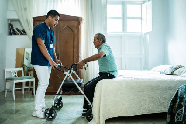 istock Home caregiver helping senior man at home 1761326726