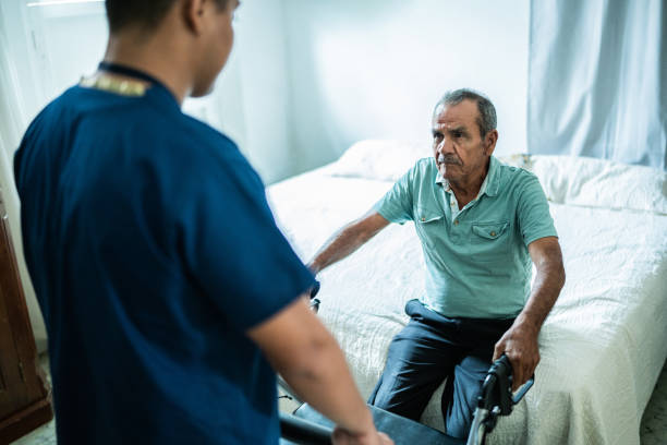 istock Home caregiver helping senior man at home 1761326728