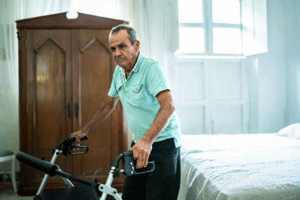 istock Senior man walking with a mobility walker at home 1761326734