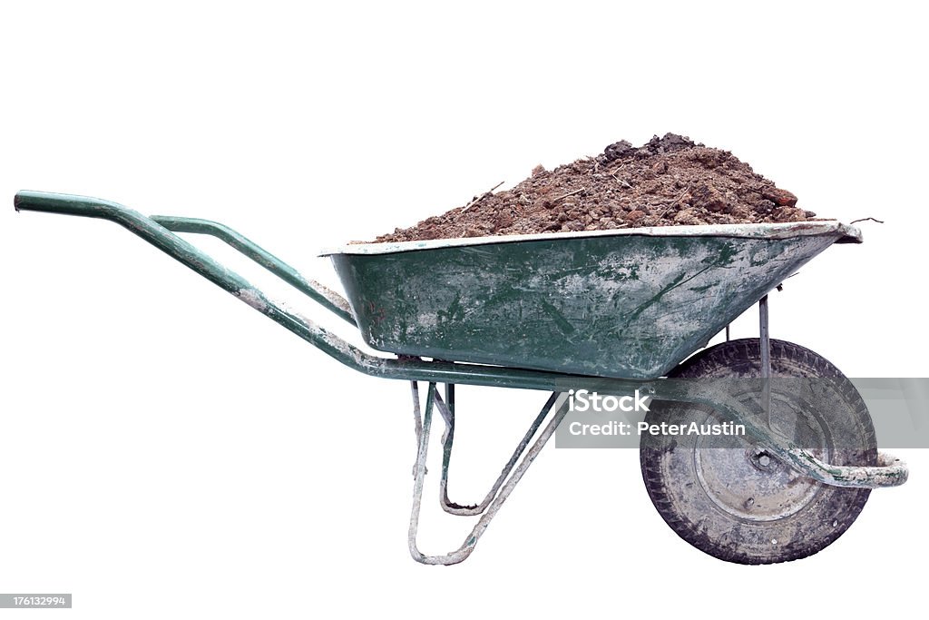 Builders Barrow - XXXLarge Construction workers well used green wheelbarrow splattered with concrete containing a full load of soil and rubble. Isolated on white Wheelbarrow Stock Photo