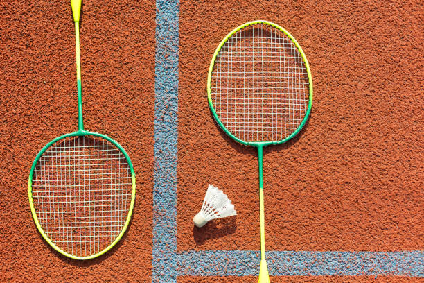 istock Badminton rackets and feather shuttlecock on the court 1761331674