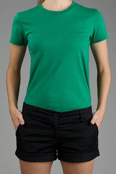 istock Young woman's torso with blank green shirt 176133379