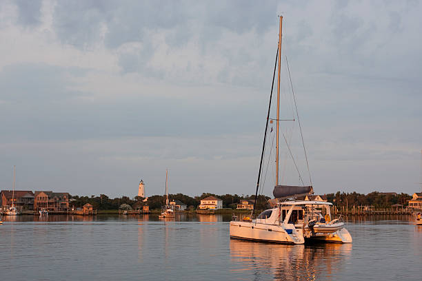 Ocracoke Harbor Dawn "Harbor with small yachts at dawn in Ocracoke, North Carolina." ocracoke island stock pictures, royalty-free photos & images