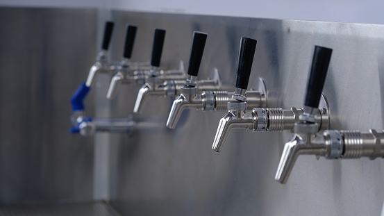 rows of clean drinking water taps.