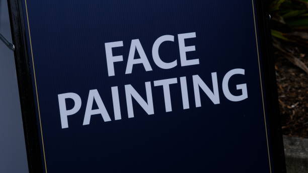 istock Face panting sighboard at a carniva 1761345807