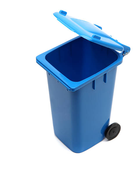 istock A wheeled blue recycling bin surrounded by al white 176134734