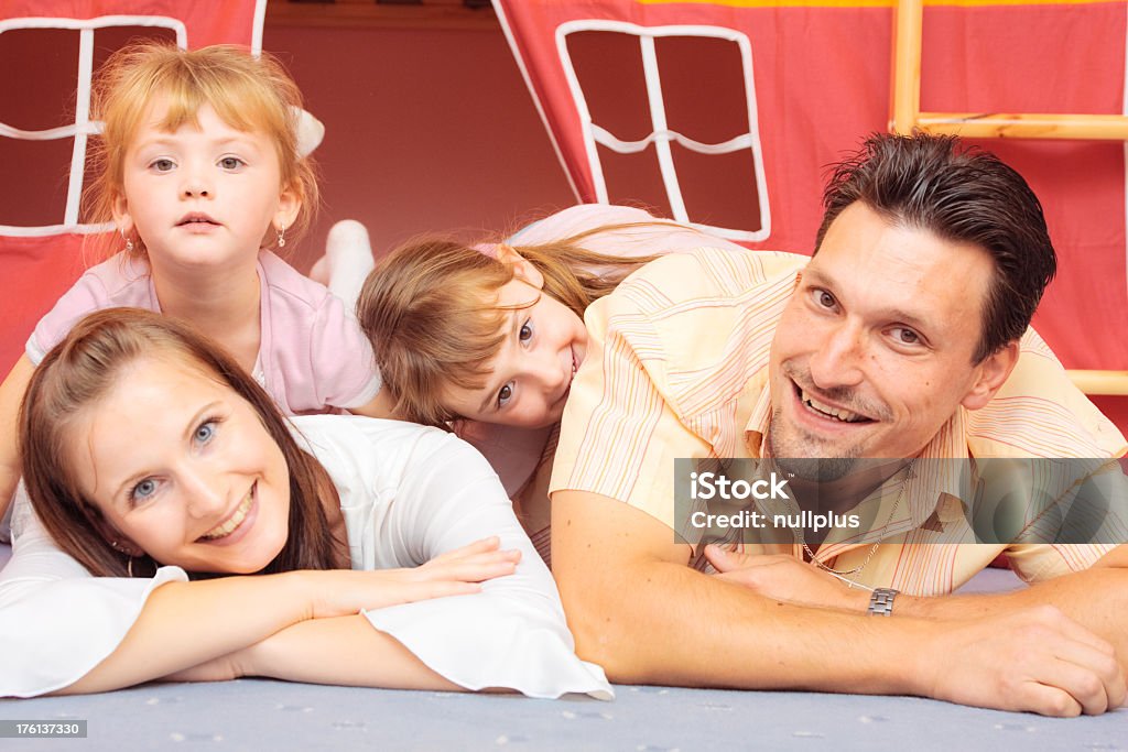 family lying en el piso - Foto de stock de Acostado libre de derechos