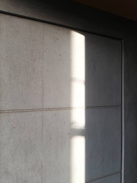 istock Gray door that opens with sunlight coming in 1761378490