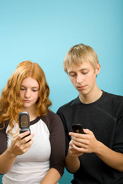istock Teenager Lost in Text Messaging 176137882