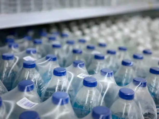 High Angle View of Packs of Bottled Drinking Water with Selective Focus