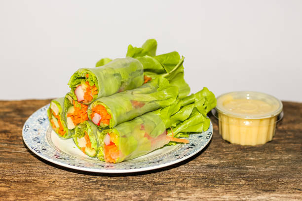 istock Salad vegetables mixed put on dish in old wooden table. 1761385969