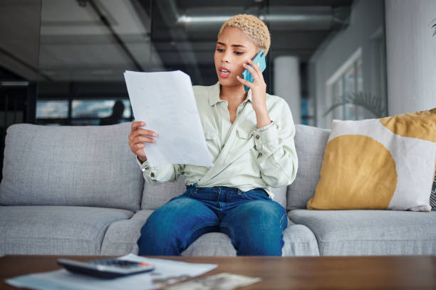 istock Angry, phone call and woman with documents, conversation and connection with network, home or speaking. Person, customer or girl with paperwork, frustrated or contact with discussion, stress or shock 1761385984