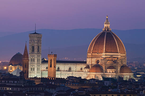 istock Florence Duomo cathedral dome illuminated at dusk Tuscany Italy 176138719