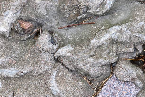 istock Detailed view on aged concrete grounds from different modern and historical buildings with cracks and a lot of structure in high resolution 1761400428