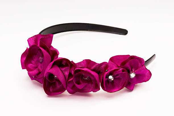 Diadem with pink silk flowers and costume diamond stone in the center of each flower.Click to See More Jewelry & Accessories!