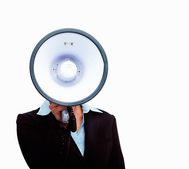 istock Businesswoman speaking into a megaphone 176141522