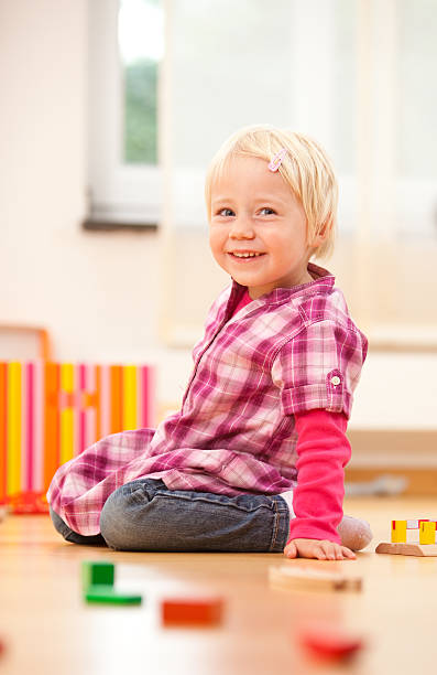 istock girls is playing with her blocks 176141628
