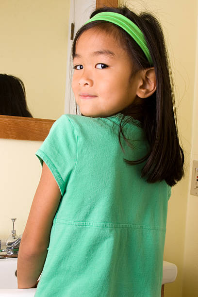 istock Girl at sink in bathroom 176145111