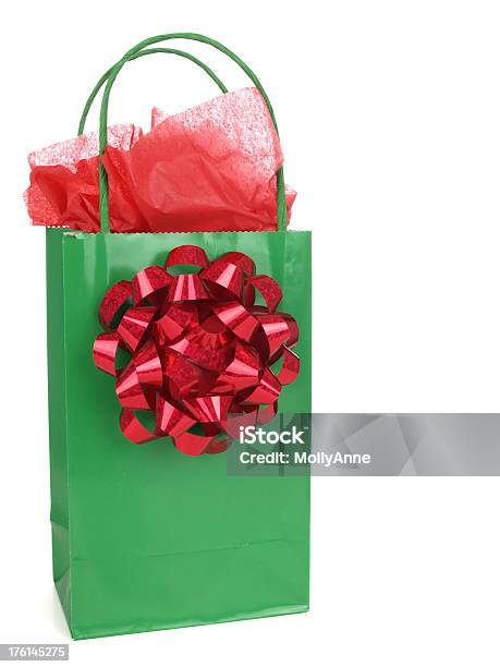 Christmas Gift Bag With Red Tissue And Bow Stock Photo - Download