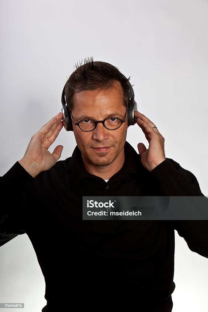 Portrait of  young man with glasses listening music ,headphones  30-39 Years Stock Photo