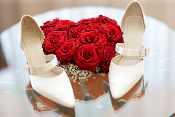 large group of white pumps with a red pair standing out from the rest. 