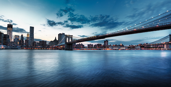 Skyline of New York and George Washington bridge over Hudson river.