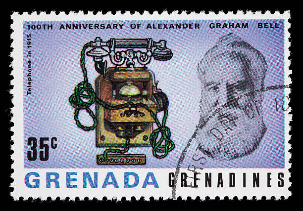 Bell and 1915 telephone postage stamp 1977 Grenada postage stamp with images of Alexander Graham Bell and a 1915 telephone. DSLR with macro lens; no sharpening. alexander graham bell stock pictures, royalty-free photos & images