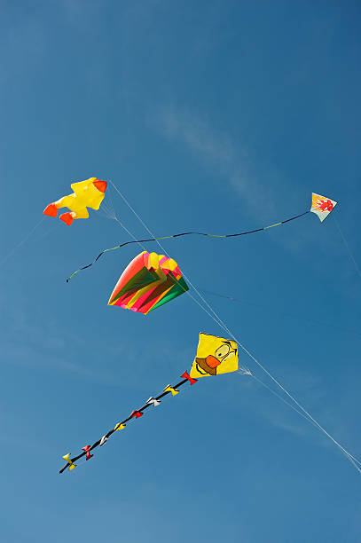 istock Multicolored large kites against a clear blue sky 176149001