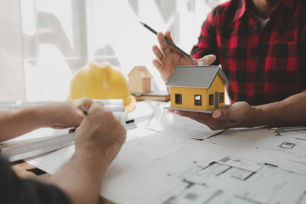 istock Design blueprints for use in structural work, Draw structural of buildings at the meeting and discuss together, engineer is in planning meeting with architect about building a house, architect idea. 1761493862