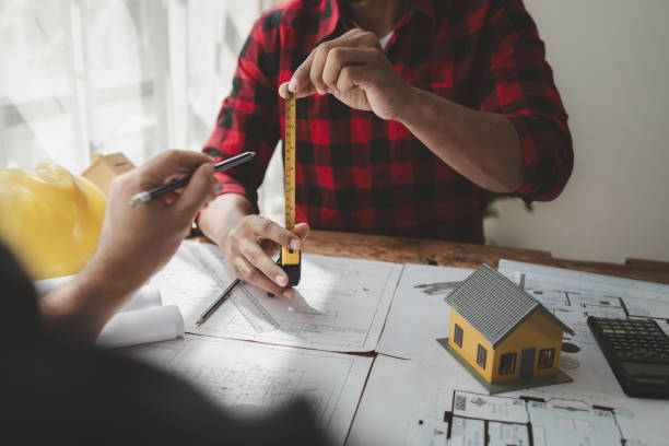 istock Design blueprints for use in structural work, Draw structural of buildings at the meeting and discuss together, engineer is in planning meeting with architect about building a house, architect idea. 1761493868