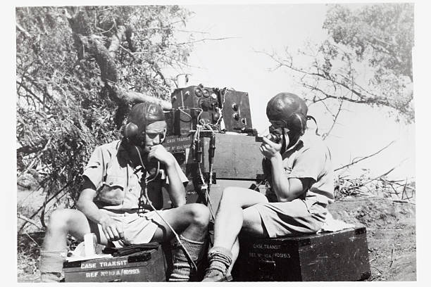 Wartime Radio Communications "Second world war image of two British soldiers communicating with base while on field operations in East Africa. Some dust and scratches which convey age of original image taken circa 1942.For more wartime imagery, please see my vintage lightbox..." surveillance photos stock pictures, royalty-free photos & images