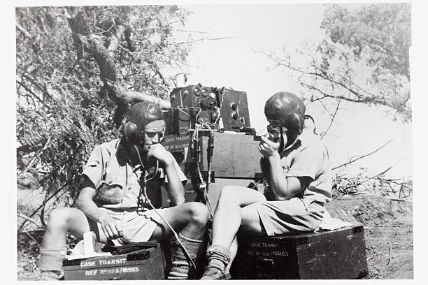 Wartime Radio Communications "Second world war image of two British soldiers communicating with base while on field operations in East Africa. Some dust and scratches which convey age of original image taken circa 1942.For more wartime imagery, please see my vintage lightbox..." radio retro revival old old fashioned stock pictures, royalty-free photos & images