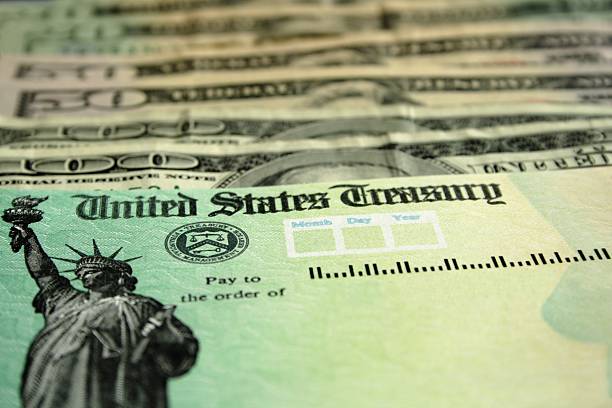 istock Tax Refund Check and Cash 176149796