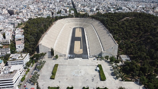 Drone photo of The Panathenaic Stadium or Kallimarmaro. It is a multi-purpose stadium located in the central Athens district of Pangrati.  
The Panathenaic Stadium was the home of the first modern Olympic Games in 1896 and remains the only stadium in the world built entirely out of marble.
