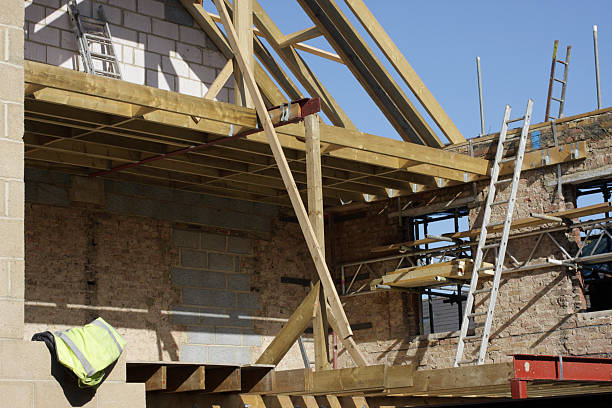 istock Roof timbers and ladder in house construction site 176150378