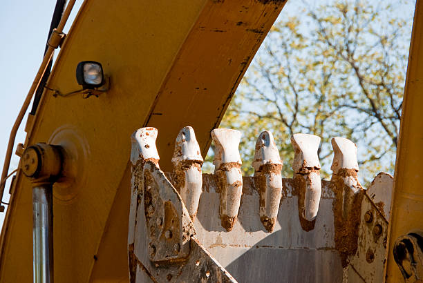 istock The scoop on yellow heavy road equipment has big teeth. 176150633