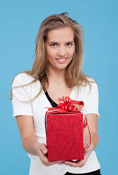 istock Young women give red Christmas Gift 176153460