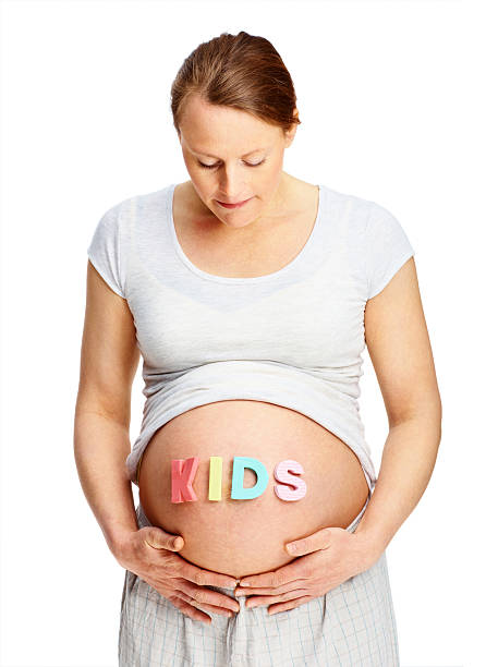 istock Pregnant woman looking at her belly 176153480