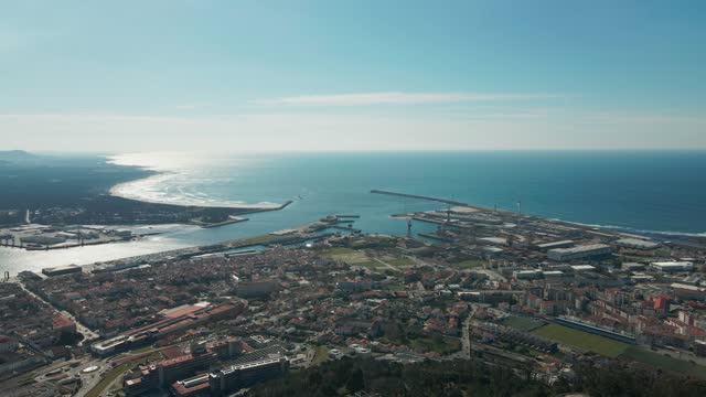 Aerial: Viana do Castelo, Portugal, showcasing coastal cityscape and port