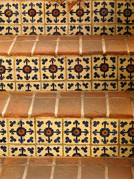 Close up of a spanish style tile and brick staircase.