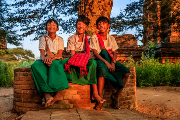 istock Young Burmese schoolboys resting in Bagan, Myanmar 1761546937
